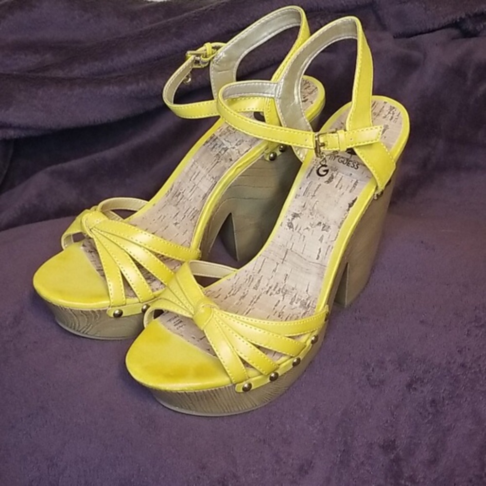 Yellow platform heel sandals by Guess